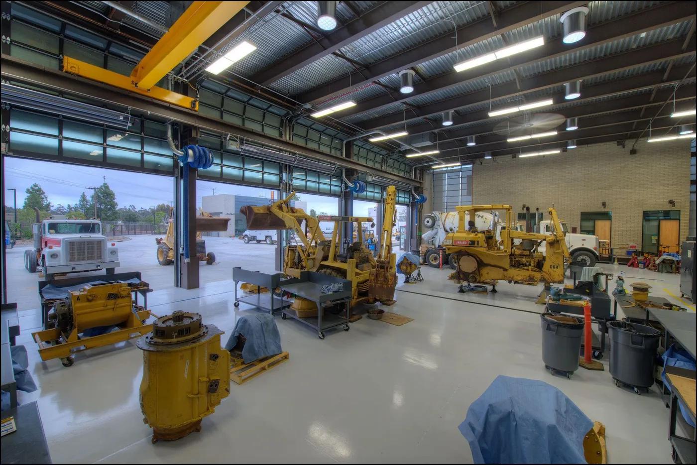 Commercial Garage Door Installation Langley: Hörmann full-view aluminum doors on a heavy-equipment shop, the type installed for Fraser Highway equipment dealers