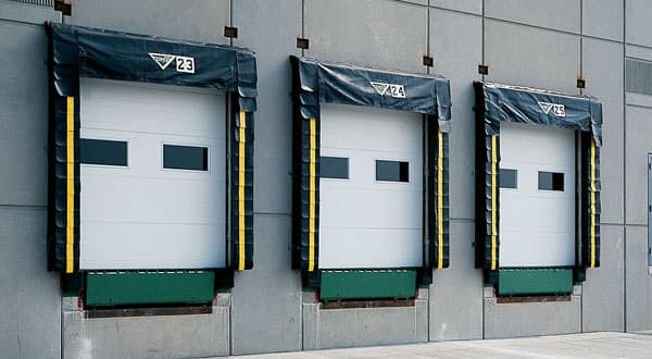 Amarr 2732 heavy-duty polystyrene insulated commercial steel sectional door with stucco panel