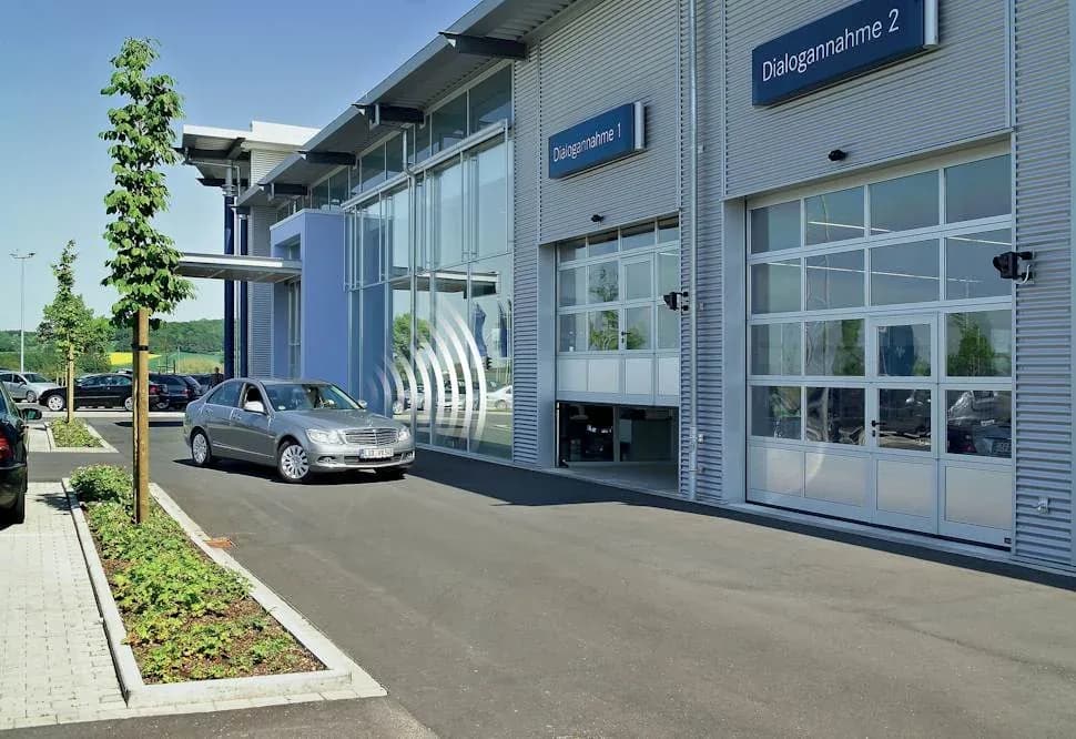 Hörmann 720A full-view aluminum doors on a dealership service bay, as installed on Lougheed Highway in Coquitlam