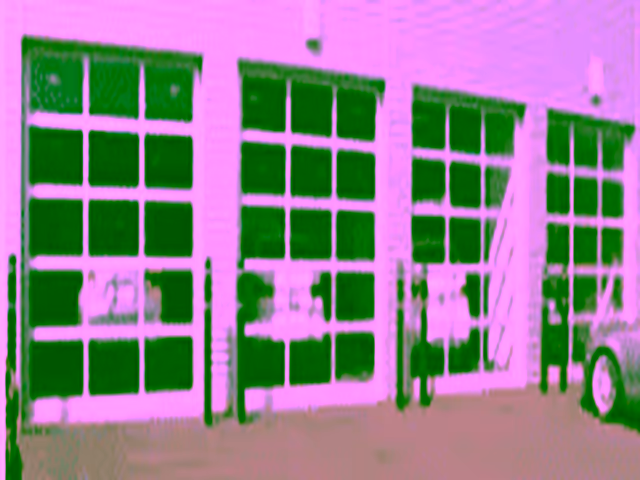 Hörmann 750A full-view aluminum and glass commercial garage door for showrooms and storefronts in Vancouver