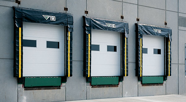 Amarr 2732 heavy-duty polystyrene insulated commercial steel sectional door with stucco panel